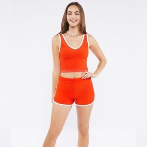 Orange and white two piece shorts and tank top set